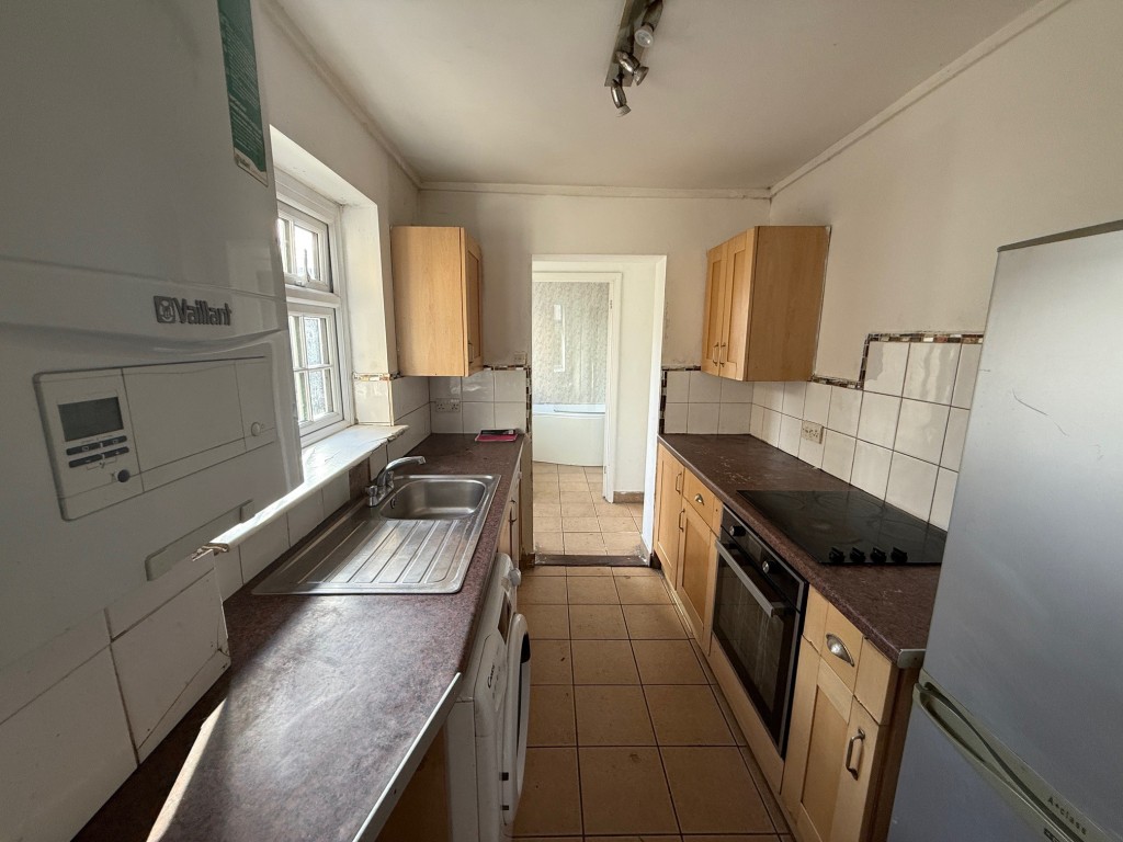 Lot: 11 - END-TERRACE HOUSE FOR IMPROVEMENT - Kitchen with window to side